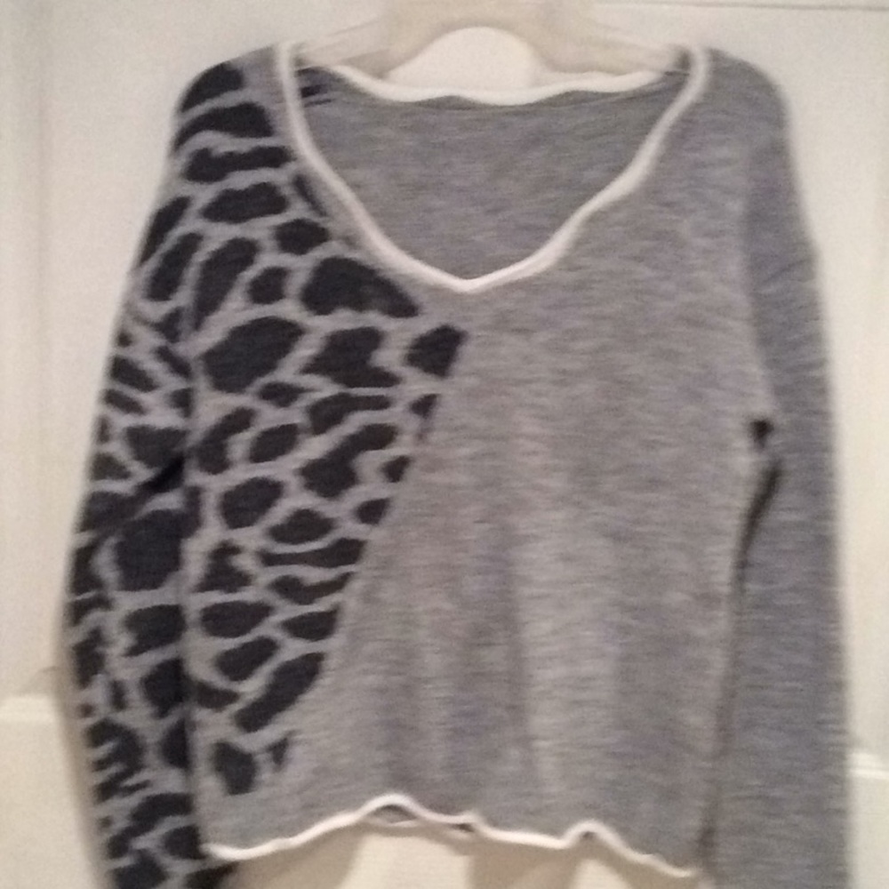 Sweater with white trim and black prints